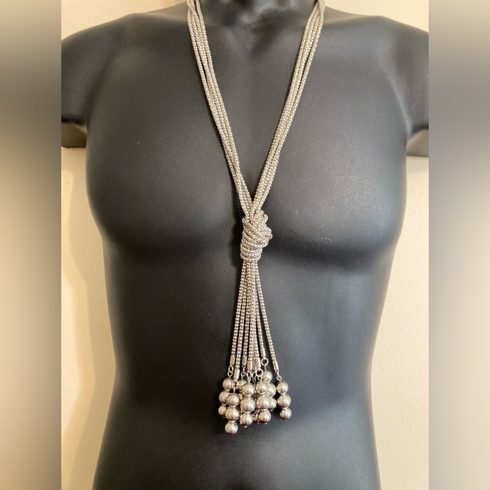 Long silver toned necklace. Knotted chain. 20”